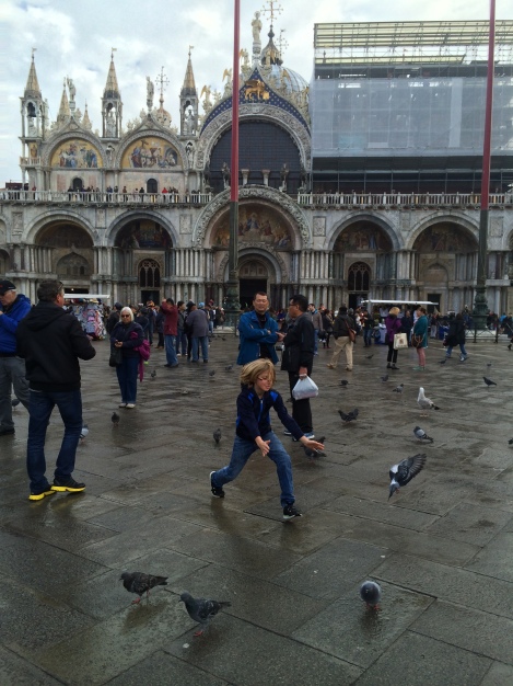 Chasing pigeons in St. Mark's Square